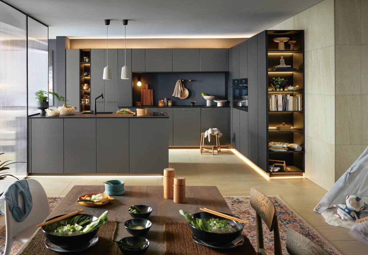 Schüller display kitchen with glass fronts, island and integrated appliances
