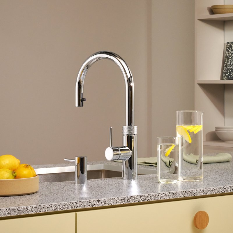 Quooker Flex Round boiling water tap in polished chrome in a grey kitchen