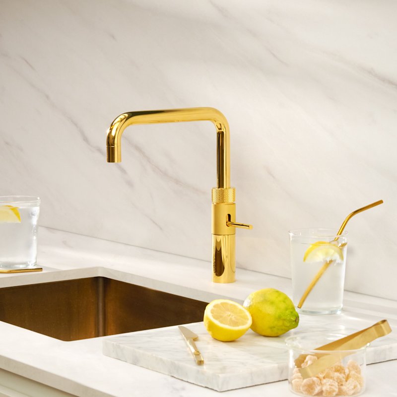 Quooker Fusion Square boiling water tap in 24 carat gold in a white kitchen